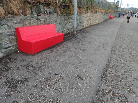 Red benches at Bray
