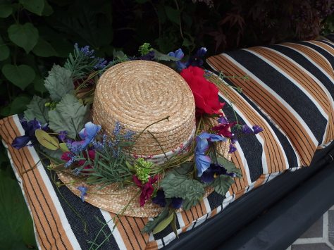 Bench with a straw hat at Chelsea Flower show
